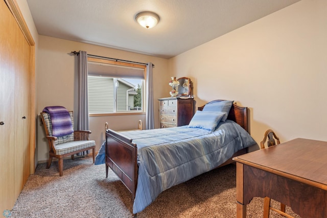 bedroom with a closet and carpet flooring