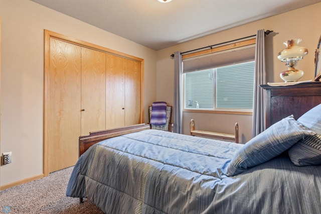 carpeted bedroom featuring a closet