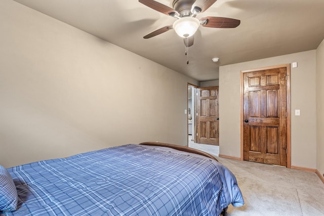 bedroom featuring light carpet and ceiling fan