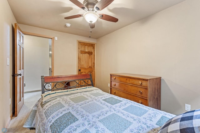 bedroom featuring light colored carpet and ceiling fan