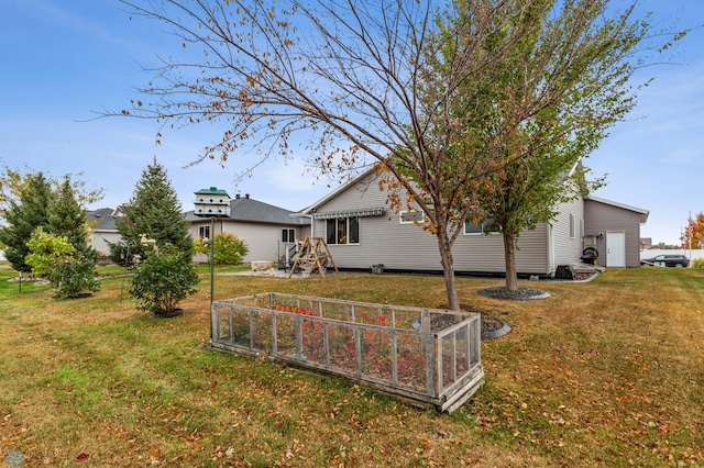 rear view of property featuring a yard