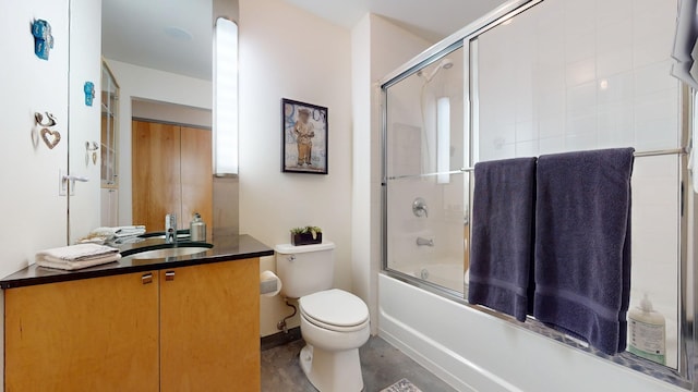 full bathroom with toilet, shower / bath combination with glass door, baseboards, and vanity