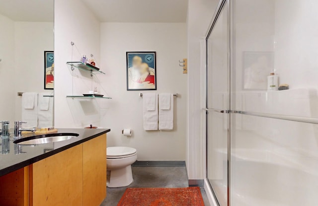 full bathroom featuring toilet, a shower stall, vanity, concrete flooring, and baseboards