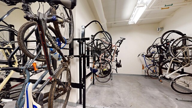 garage with bike storage and baseboards