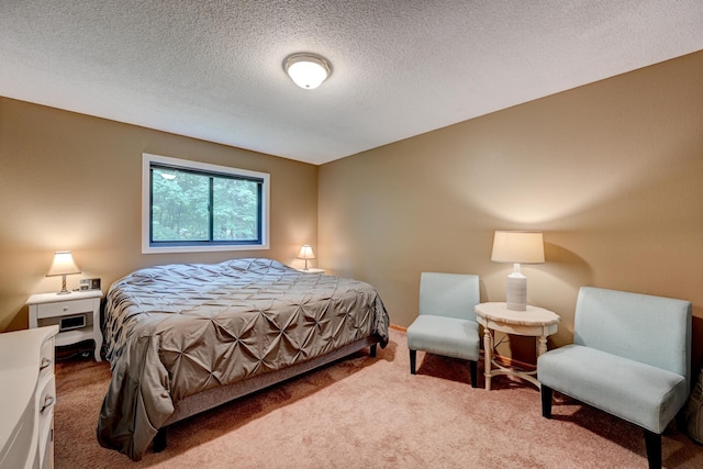 carpeted bedroom featuring a textured ceiling