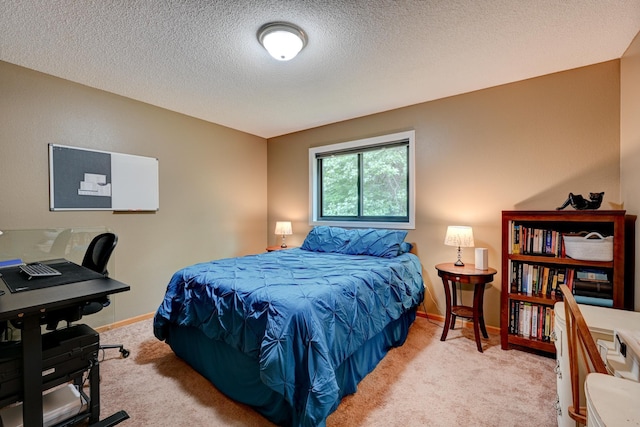 carpeted bedroom with a textured ceiling