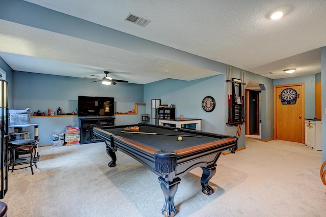 game room featuring ceiling fan, carpet, a textured ceiling, and billiards