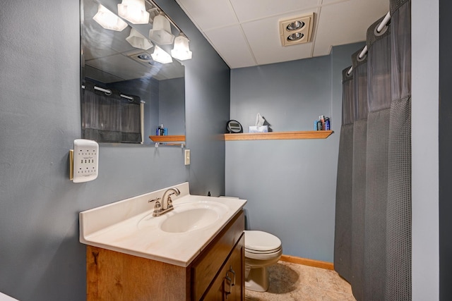 bathroom featuring tile patterned floors, vanity, and toilet