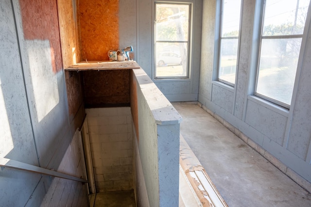 interior space with concrete floors and a healthy amount of sunlight