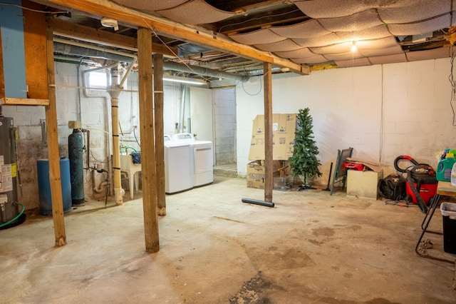 basement featuring gas water heater and washing machine and clothes dryer