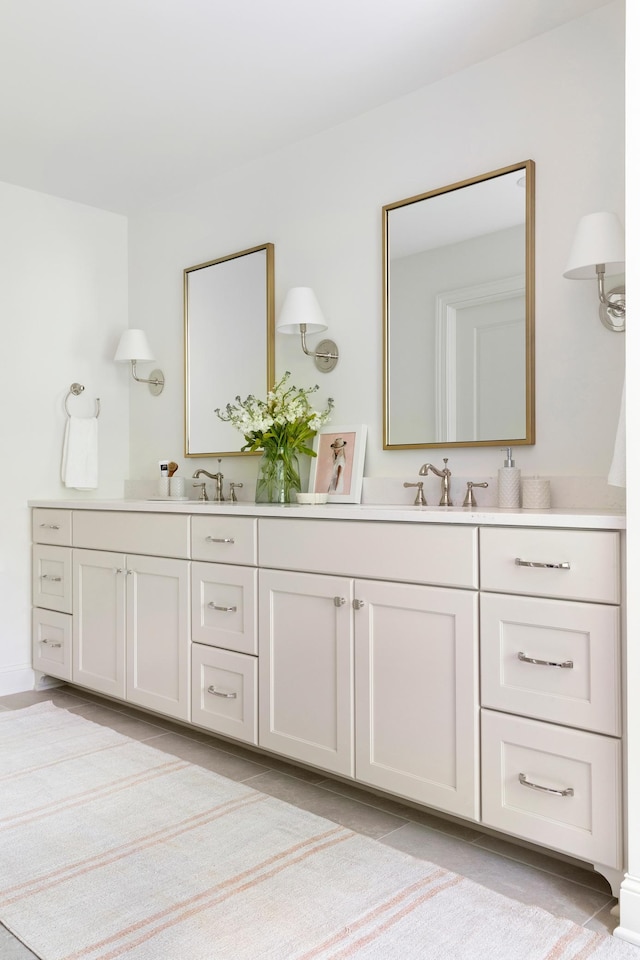 bathroom with tile patterned floors and vanity