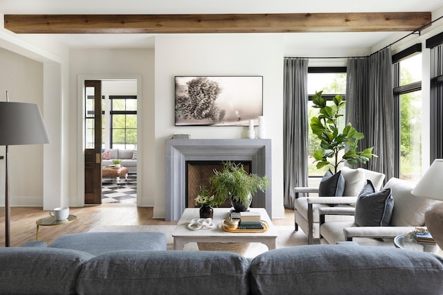 sitting room featuring a wealth of natural light and light hardwood / wood-style floors