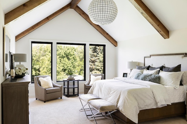 carpeted bedroom with beamed ceiling and high vaulted ceiling