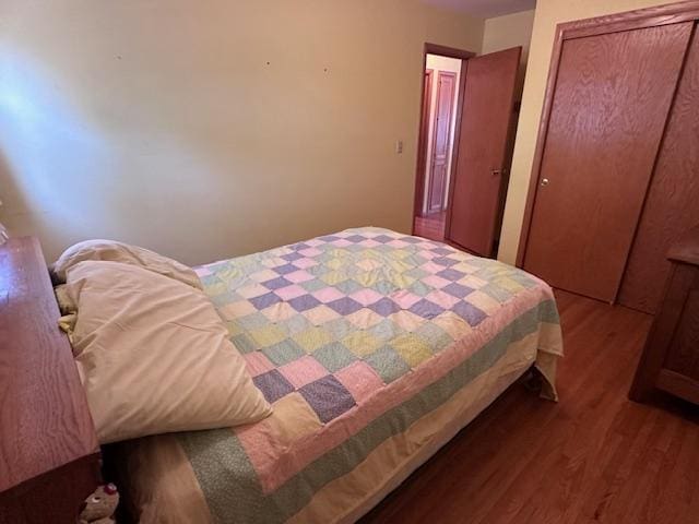bedroom with wood finished floors