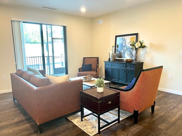 living room with dark hardwood / wood-style floors