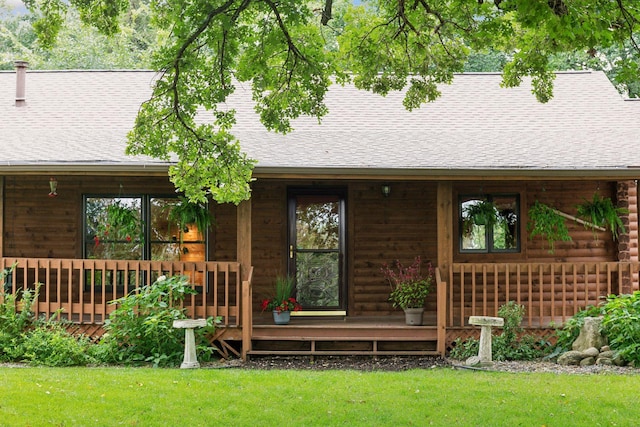 exterior space featuring a yard and covered porch