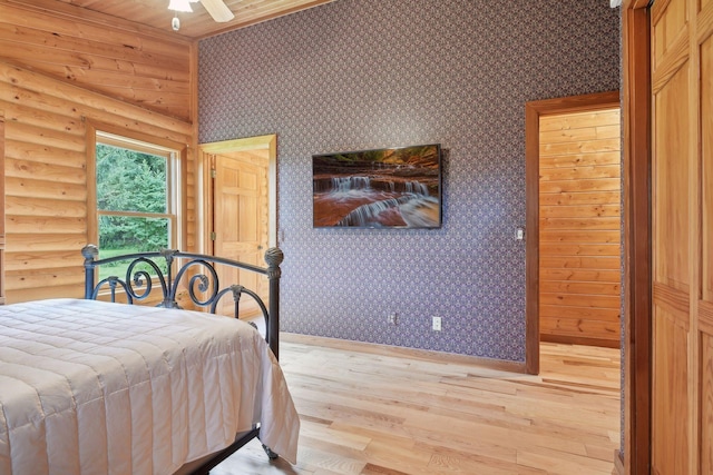 bedroom with ceiling fan and light hardwood / wood-style flooring