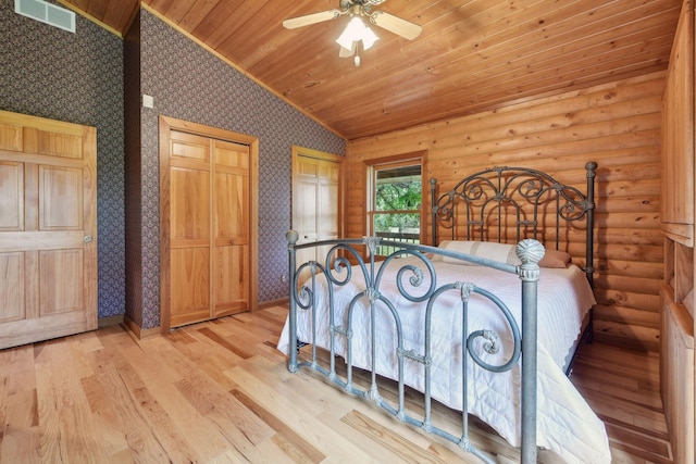 bedroom featuring ceiling fan, vaulted ceiling, wood ceiling, and light hardwood / wood-style flooring