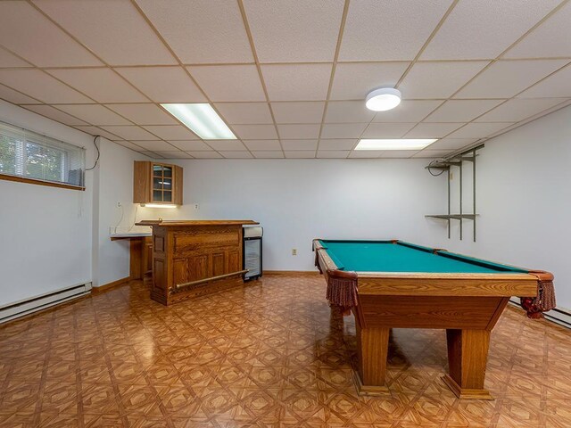 game room with a baseboard radiator, billiards, a paneled ceiling, and indoor bar