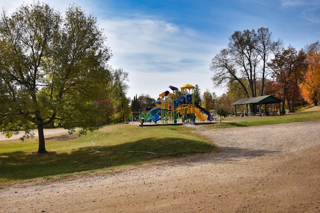 view of home's community featuring a playground, a gazebo, and a lawn