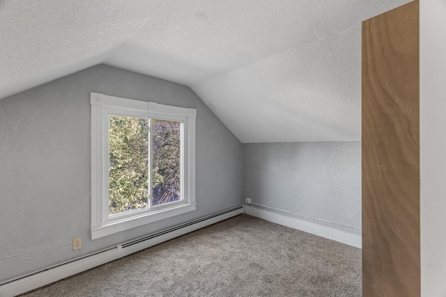 bonus room with carpet, vaulted ceiling, a baseboard heating unit, and a textured ceiling