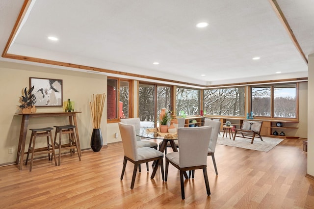 dining room featuring light wood-type flooring and recessed lighting