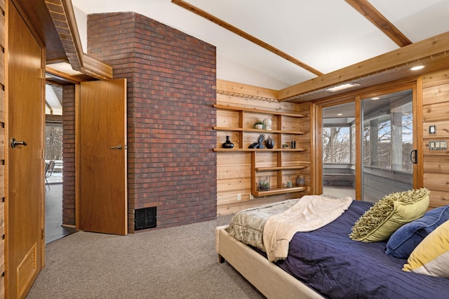 carpeted bedroom with access to exterior, visible vents, vaulted ceiling with beams, and wooden walls