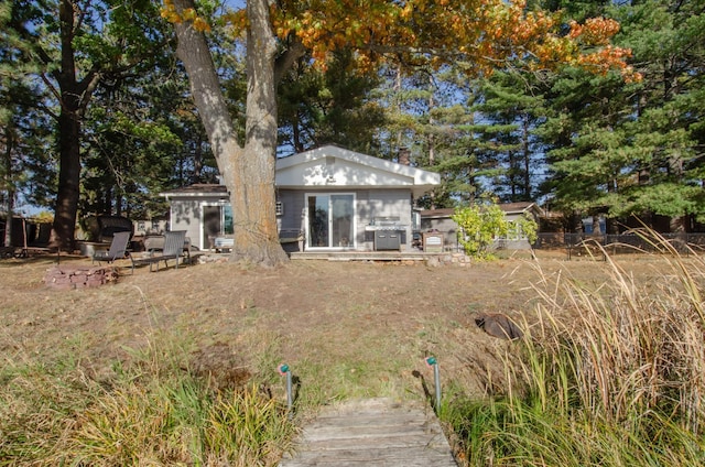 rear view of property featuring a patio