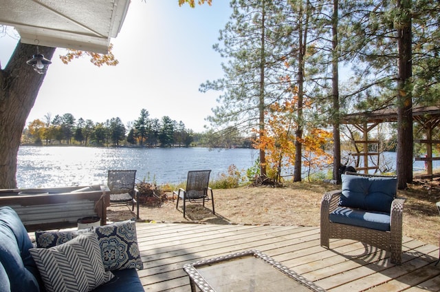 wooden deck featuring a water view