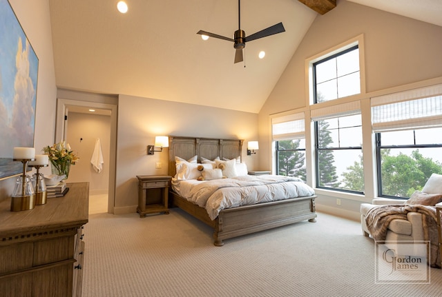 bedroom featuring ceiling fan, light colored carpet, multiple windows, and high vaulted ceiling