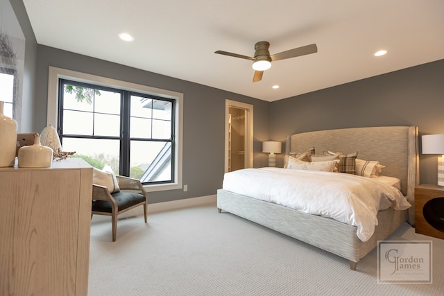 bedroom with ceiling fan, carpet floors, a closet, and a spacious closet