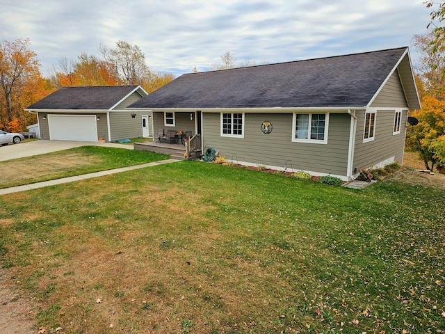 ranch-style home featuring a front lawn and a garage