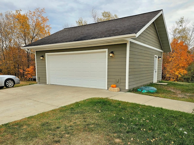 garage with a lawn