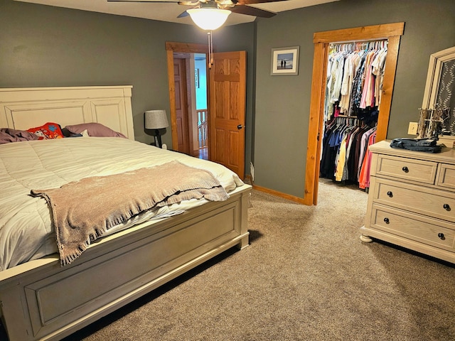 carpeted bedroom featuring ceiling fan and a closet