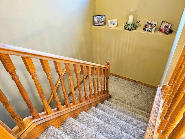 stairs featuring carpet