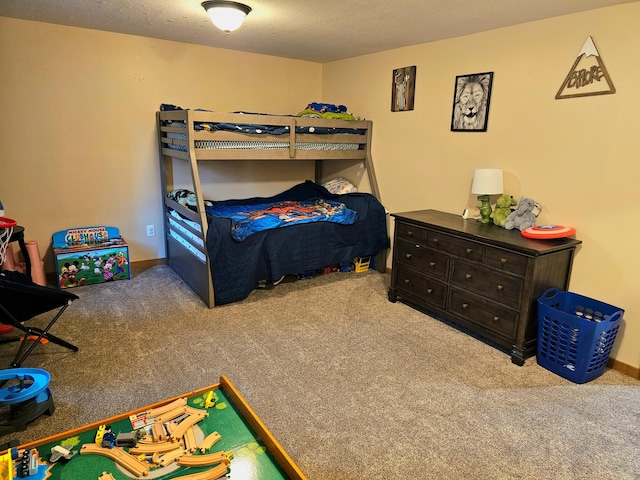 carpeted bedroom featuring a textured ceiling