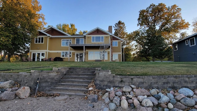 view of front of home featuring a front yard