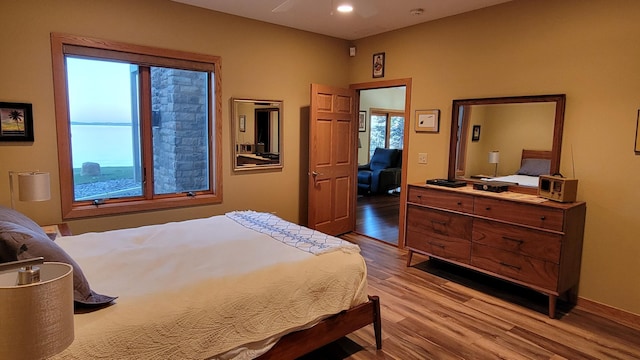 bedroom featuring ceiling fan and light wood-type flooring