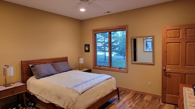 bedroom featuring ceiling fan and light wood-type flooring