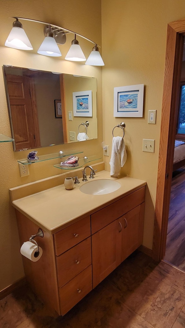 bathroom with vanity and hardwood / wood-style floors