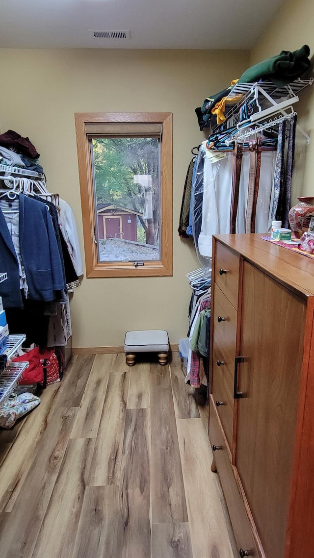 spacious closet featuring light hardwood / wood-style floors