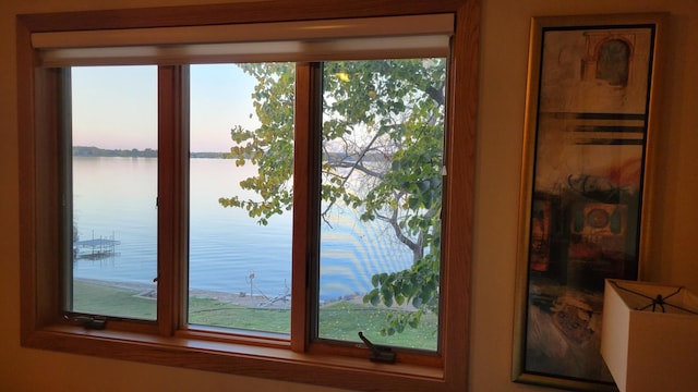 entryway with a water view and a healthy amount of sunlight