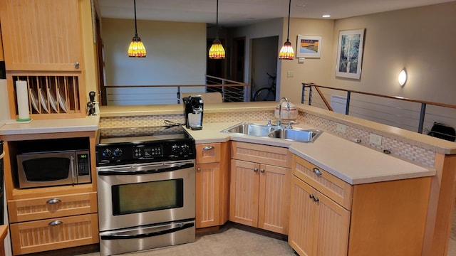 kitchen with kitchen peninsula, tasteful backsplash, stainless steel appliances, sink, and decorative light fixtures