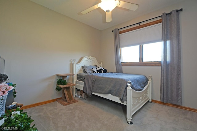 bedroom with light carpet and ceiling fan