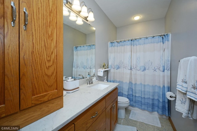 bathroom featuring vanity, toilet, and a shower with shower curtain