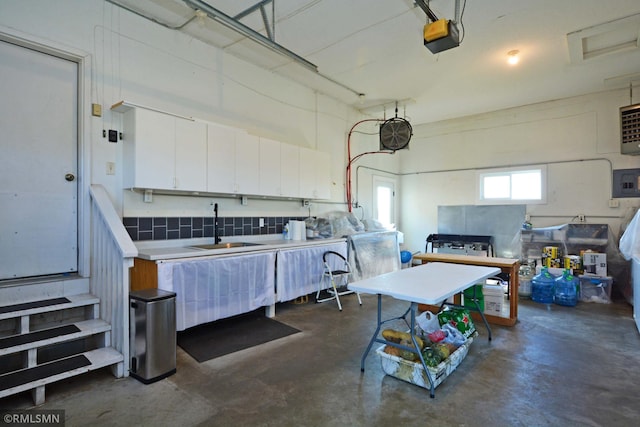 interior space featuring sink and a garage door opener