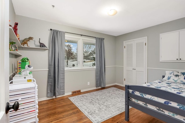 bedroom with a closet and wood-type flooring