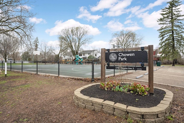 view of basketball court with a playground