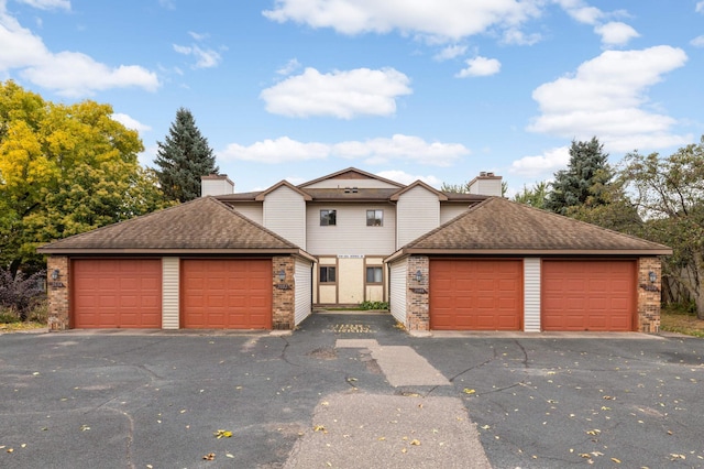 view of front property with a garage and an outdoor structure