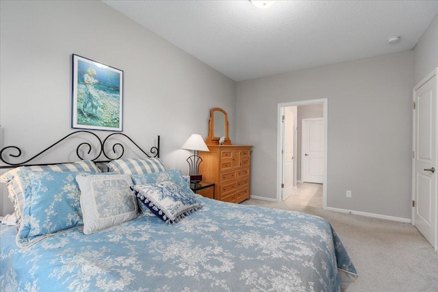 carpeted bedroom with a textured ceiling